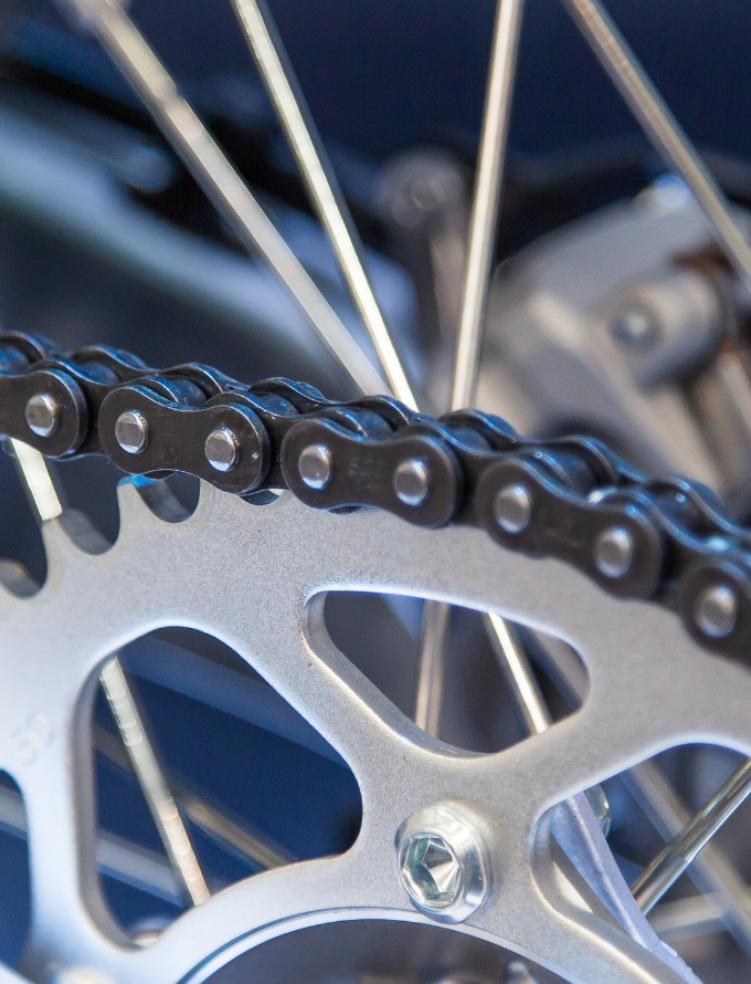 Close-up of a bicycle chain and gear mechanism.